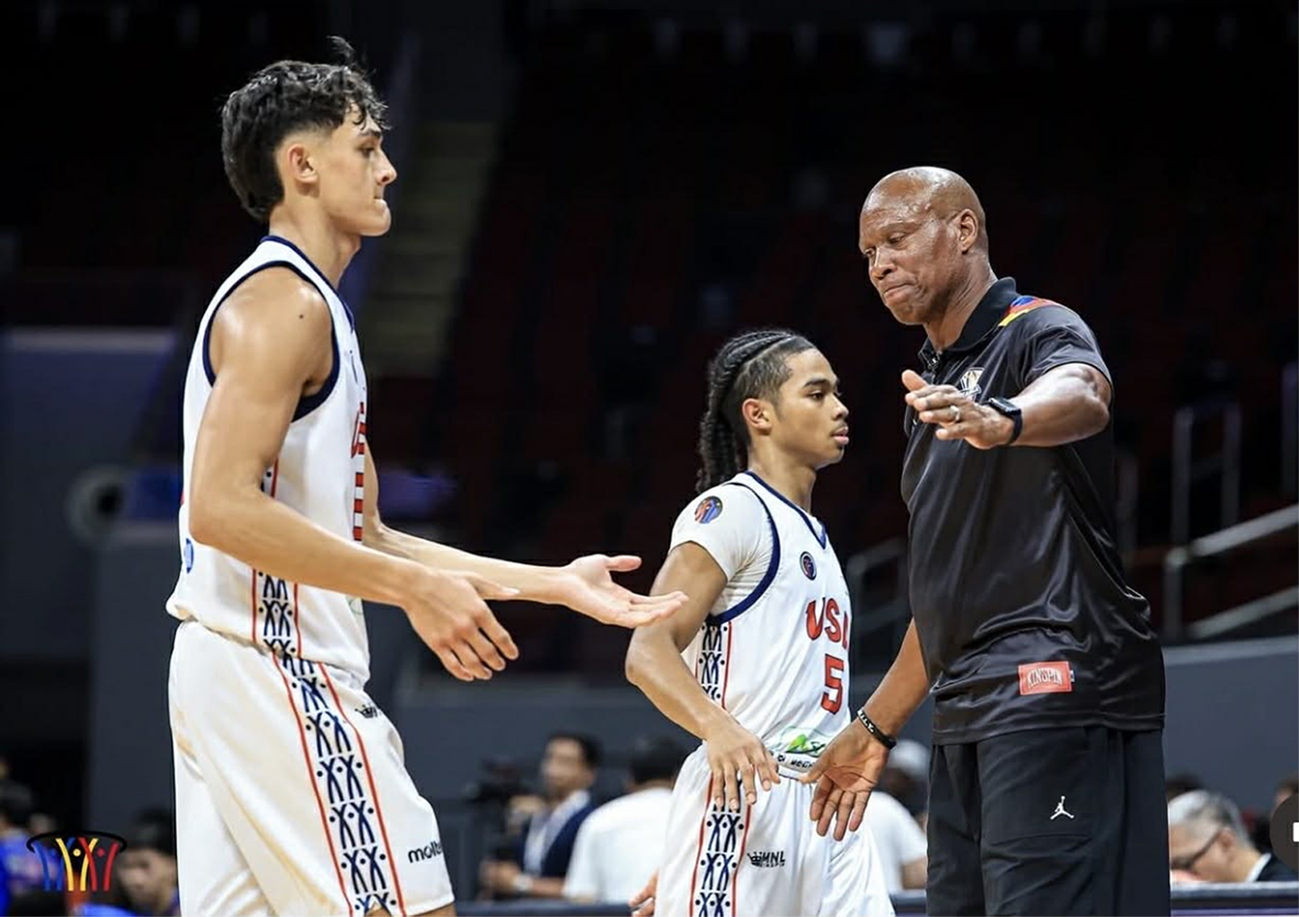 Basketball players and coach on the court